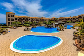 Relax in the sun at apartment with ocean view and pool